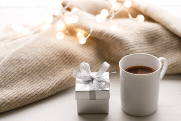 Cups of delicious hot chocolate and artisanal gift box