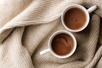 Cups of delicious hot chocolate and artisanal gift box