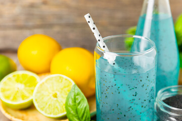 Diet detox cocktail with basil and chia seeds in a glass jar and a glass on a textured background. Drink with seeds. Health food. Detox cocktail. Antioxidant. Water with basil. Space for text. 