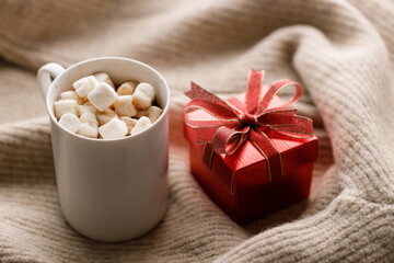 Cups of delicious hot chocolate and artisanal gift box