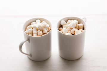 Cups of delicious hot chocolate and artisanal gift box