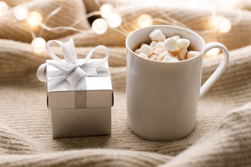 Cups of delicious hot chocolate and artisanal gift box