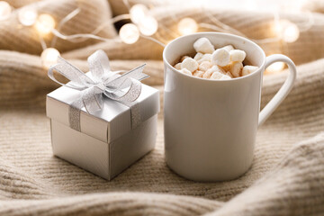 Cups of delicious hot chocolate and artisanal gift box
