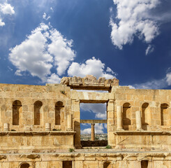 Roman ruins (against the background of a beautiful sky with clouds) in the Jordanian city of Jerash (Gerasa of Antiquity), capital and largest city of Jerash Governorate, Jordan