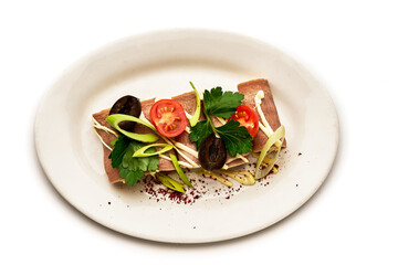 A plate of food with a white plate and a white background
