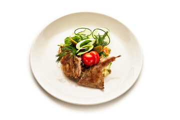 A plate of food with meat and vegetables on it