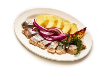 A plate of food with fish, potatoes, and onions