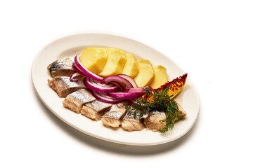 A plate of food with fish, potatoes, and onions