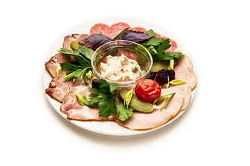 A plate of food with a variety of meats and vegetables, including tomatoes