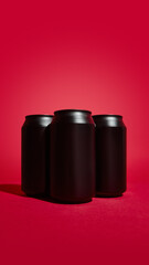 Three identical black aluminum beverage cans, suitable for soda, beer, or energy drinks promotion, arranged on red background. Minimalist and striking visual. Mockup for drinks branding, ads