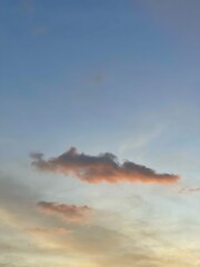Fototapeta premium Beautiful colorful sky and cloud in twilight time background. Orange fluffy clouds and sun sunlight reflection in the blue sky. 