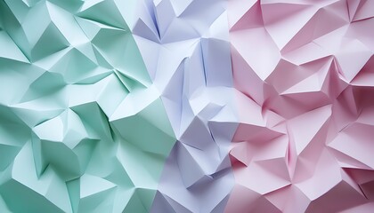 Obraz premium A close-up of crumpled pastel paper in mint green and soft pink hues.
