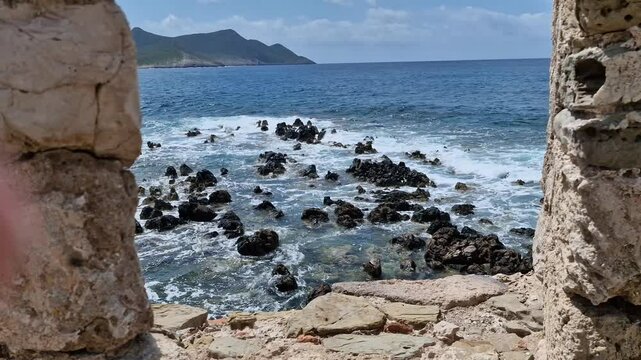 Rocky sea near Methoni Castle Venetian fort ruins, Peloponnese, Greece