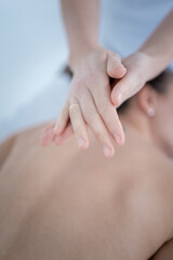 Closeup of masseuse hands. he rubs the oil in his hands