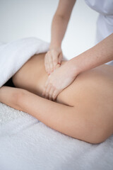Obraz premium Close-up of masseur's hands on back. close-up masseur hands doing back massage in spa salon. Beauty treatment concept.