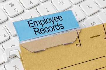 A brown file folder labeled with Employee records