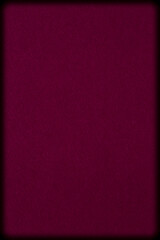 Fototapeta premium dark maroon cardboard with rounded corners against black background