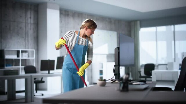 Female Janitor With Mop Cleaning Modern Office