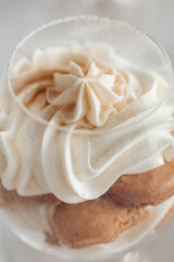 Tiramisu cake in glass jars. Traditional italian layered dessert in glasses. Closeup view. stock photo