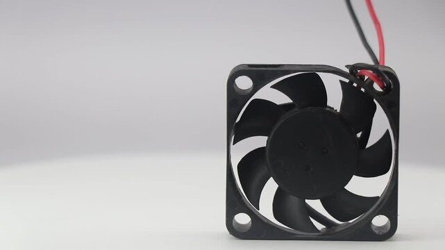 CPU cooling fan also called as pc fan with its rotating view isolated on white background