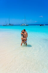 Obraz premium Young couple on Caribbean beaches