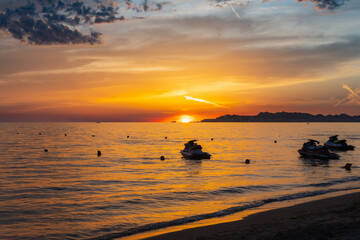 Sunset on the beach in Albania with beautiful clouds © Grzegorz