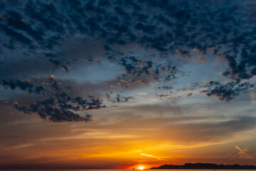 Sunset on the beach in Albania with beautiful clouds © Grzegorz