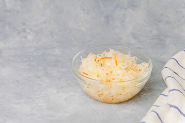 Top view of plate with sauerkraut on neutral light background