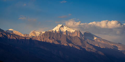 Sunset landscape view of Karl Marx peak in Shakhdara mountain range with Engels in background, from...