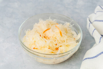 Top view of plate with sauerkraut on neutral light background