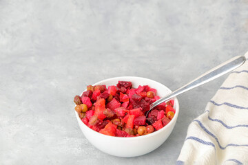 Vinaigrette beetroot alad on neutral background