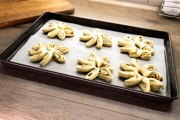 Puff pastry flowers with cinnamon sugar.Puff pastry. Dessert. Cinnamon. Sugar. Food concept