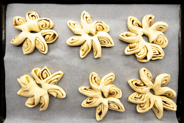 Puff pastry flowers with cinnamon sugar.Puff pastry. Dessert. Cinnamon. Sugar. Food concept