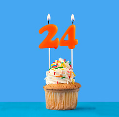 Orange birthday candle and cupcake - Number 24