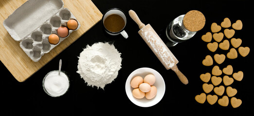 Set of ingredients for the preparation of cookies -  flour, sugar, eggs, spices, cocoa, cookies, slicing, top view , Baking a cake, pastry board, natural light