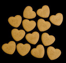 heart-shaped gingersnaps on black background