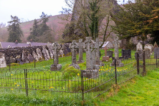 an old cemetery with large graves in cloudy weather in walse