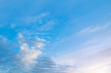 Picturesque evening sunset sky background, scenic cumulus clouds in the picturesque sunset sky, evening sky view