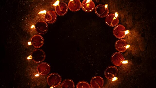 Organic diya lamps made from clay filled with oil and lit to celebrate the hindu festival
