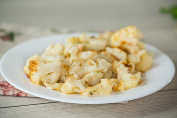 Diet boiled cauliflower fried in oil with spices