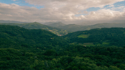 Fototapeta premium A breathtaking view of lush green hills unfolds, capturing the serenity of the French Pyrenees on the Camino de Santiago.