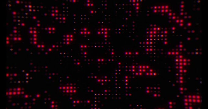 Abstract red dot pattern on black background.