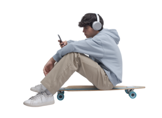 Skater sitting and using a smartphone