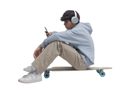 Skater sitting and using a smartphone