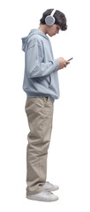 Teenager standing and using a smartphone