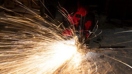 Sparks from processing metal with a grinder