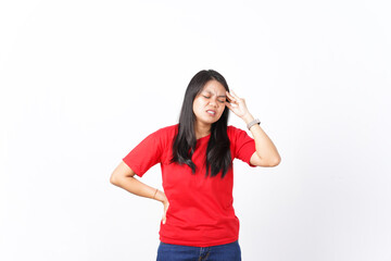 beautiful Asian woman holds her head in pain, expressing a headache, against a white background