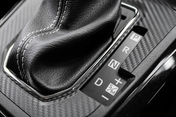 Close-up view of an automatic gear shift lever of a car.
