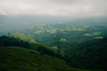 A breathtaking view of lush green hills unfolds, capturing the serenity of the French Pyrenees on the Camino de Santiago.