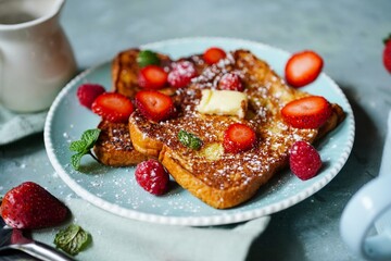 Homemade French toast with Brioche bread topped with berries